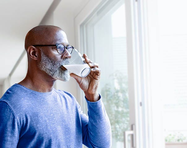 Man drinking Man drinking a glass of milk